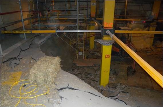 A large pile of hay in a building
Description automatically generated