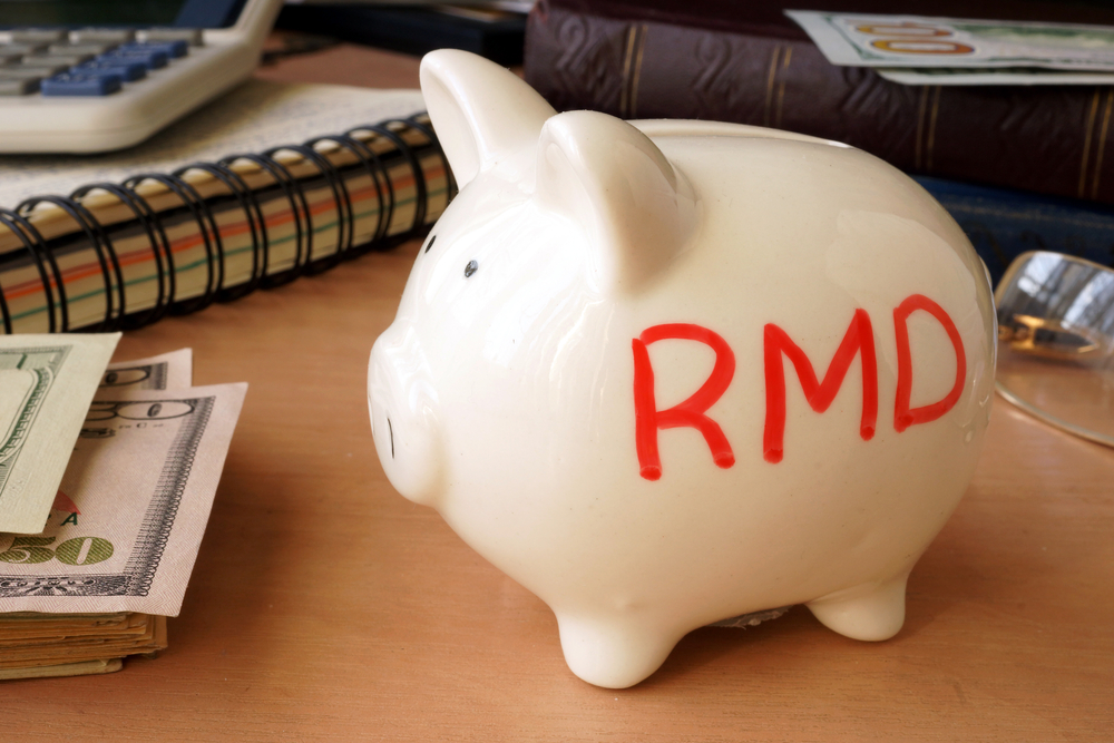 Piggy bank with R M D (for required minimum distributions) written on it.