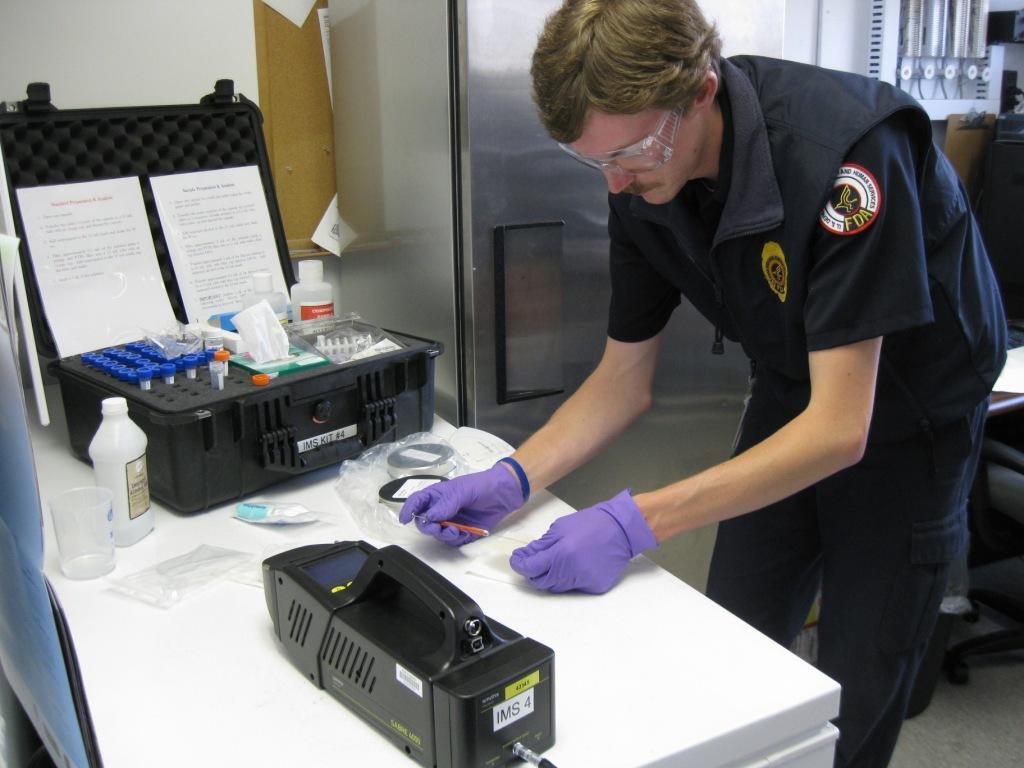 FDA Inspector with Syringe