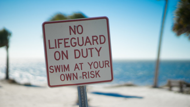 No Lifeguard on Duty - Swim at Your Own Risk sign