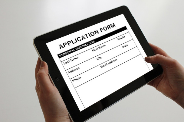 A digital application form shown on a tablet or iPad